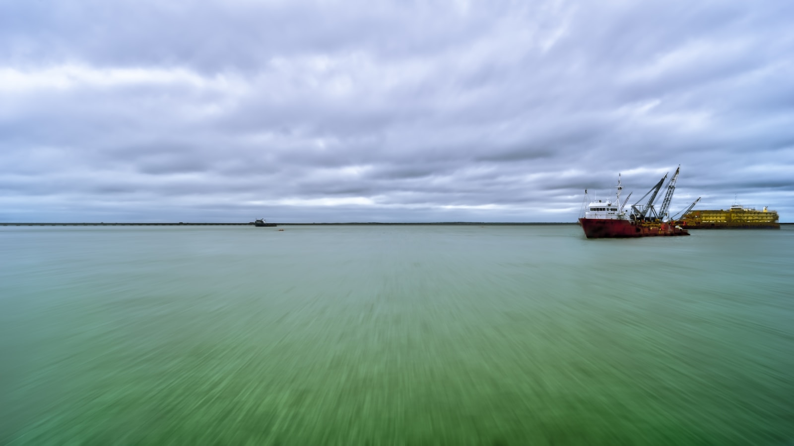 a large boat floating on top of a large body of water